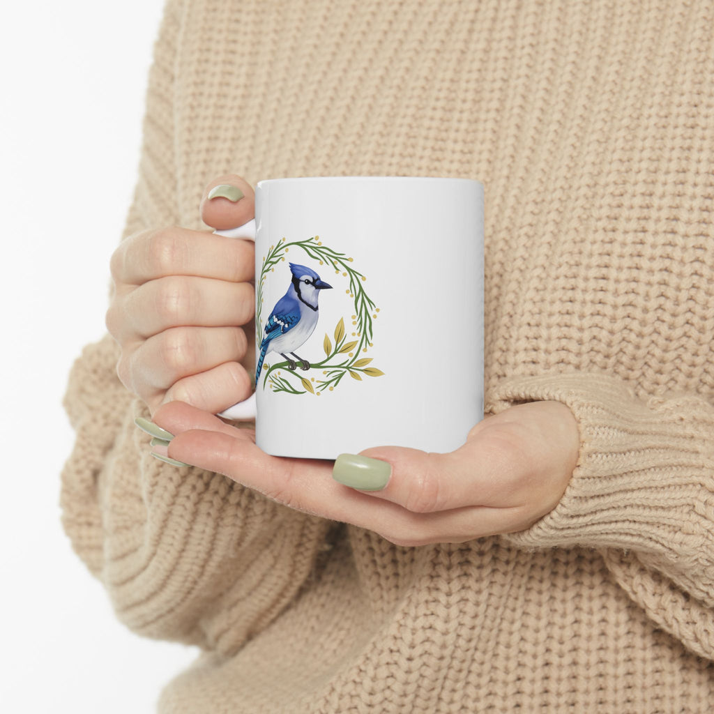 White mug with a blue jay design