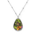Teardrop-shaped pendant with a monarch butterfly photo