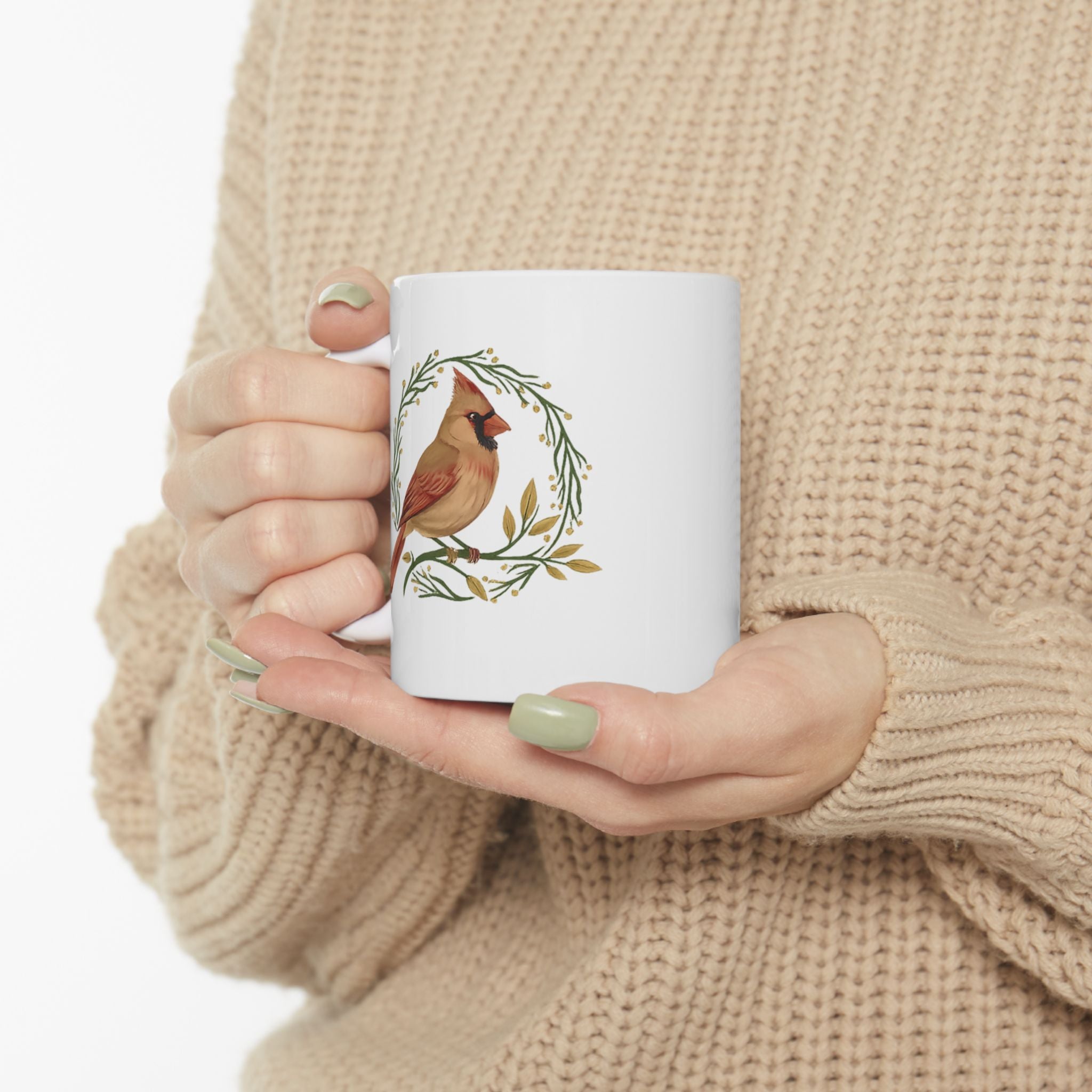 White mug with a cardinal bird design 