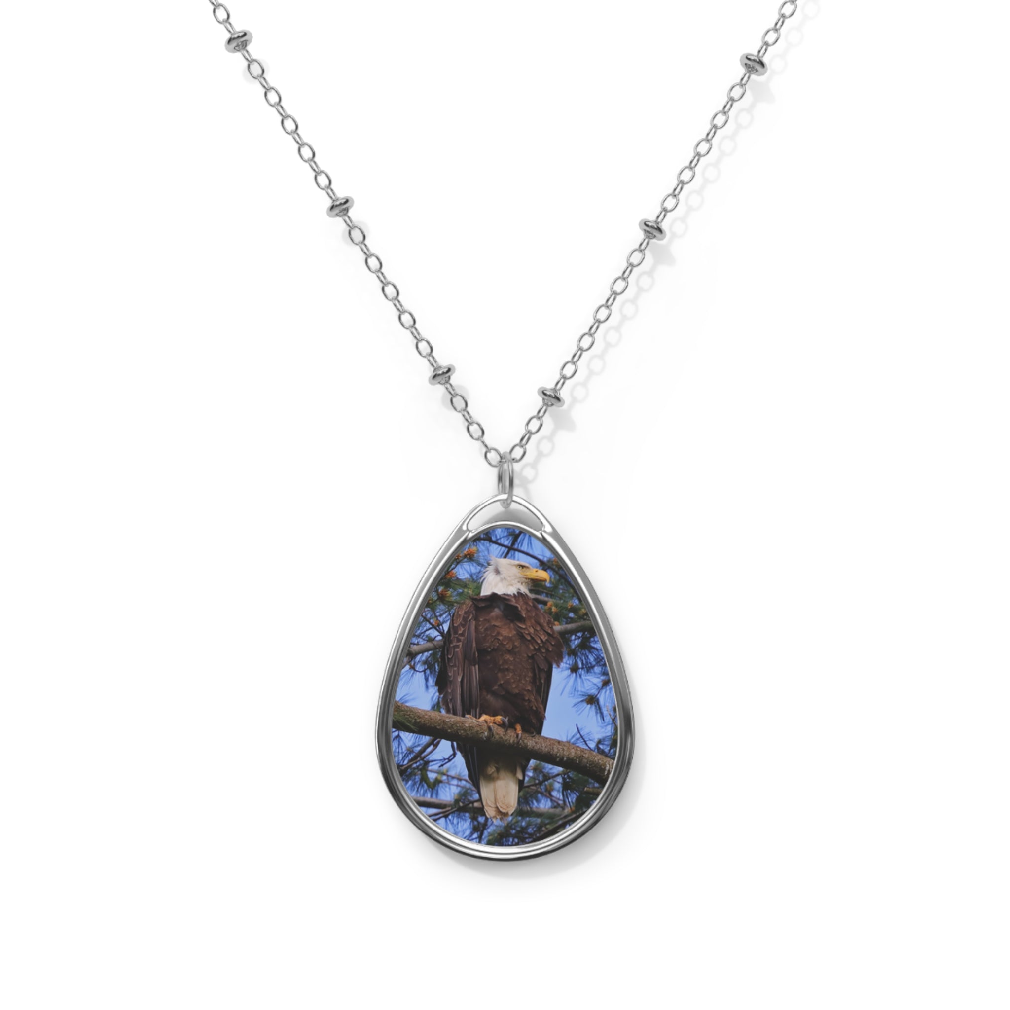 Teardrop-shaped pendant with a bald eagle photo