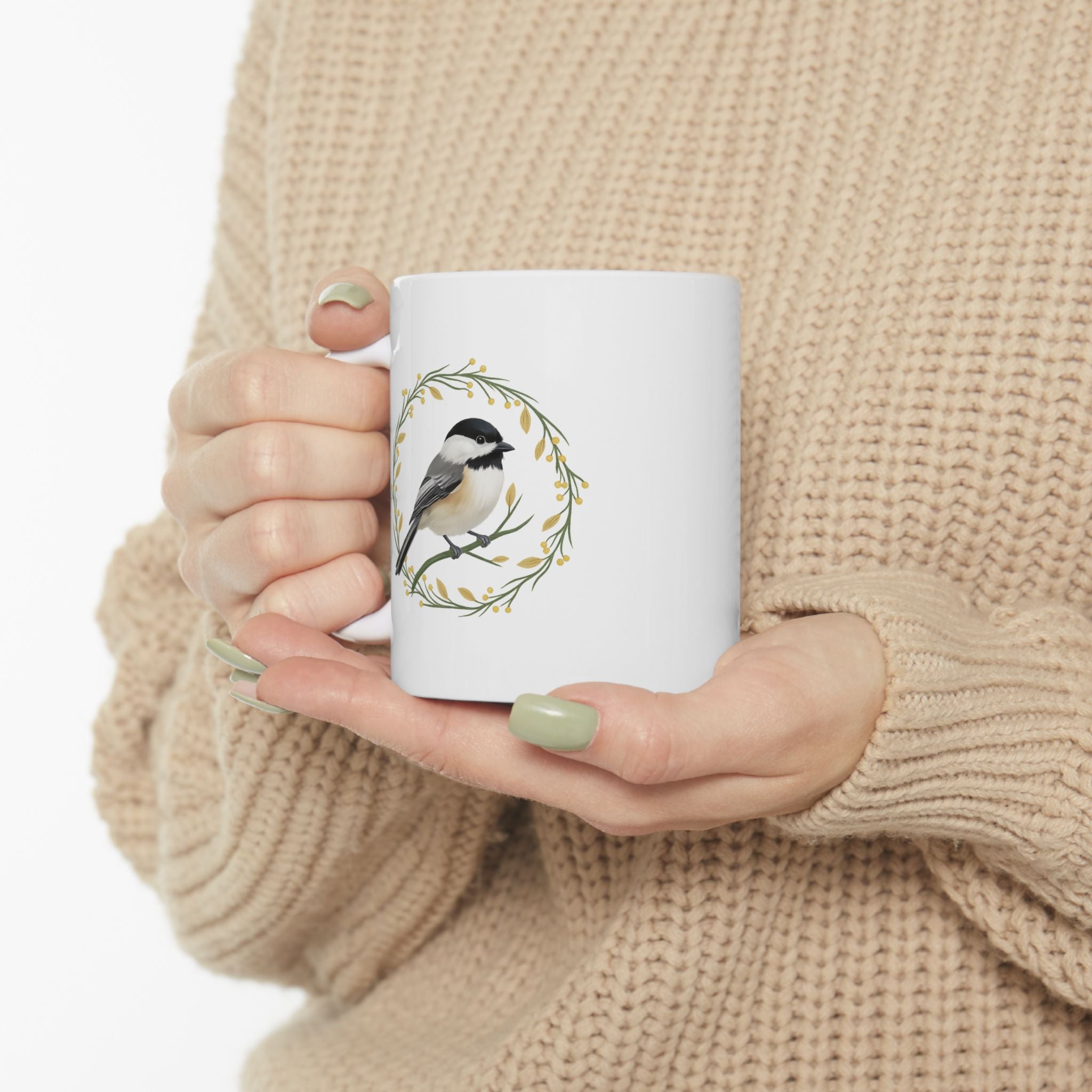 White mug with a chickadee design
