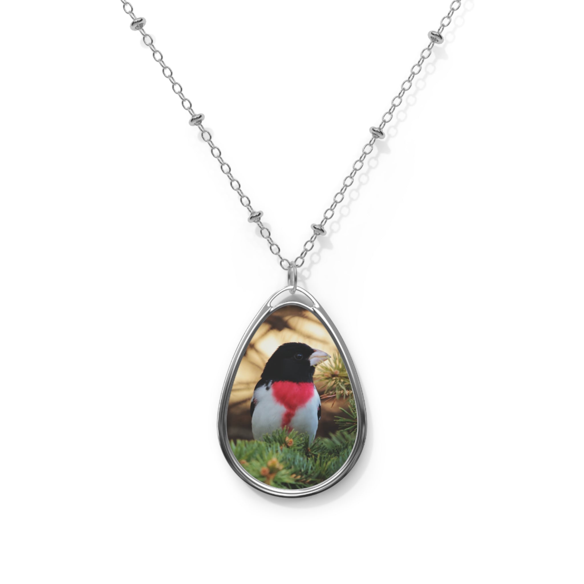 Teardrop-shaped pendant with a rose-breasted grosbeak photo