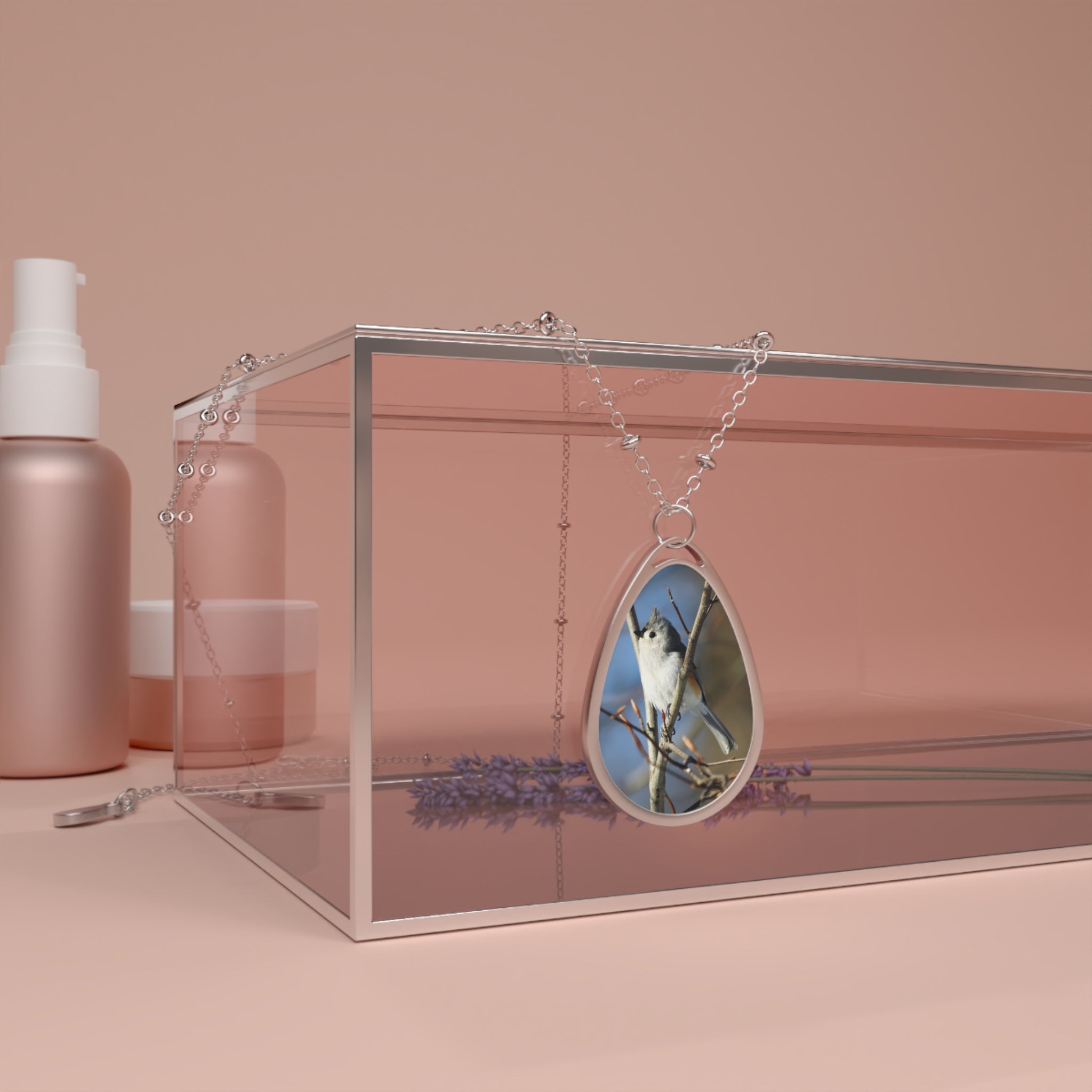 Teardrop-shaped pendant with a wood tufted titmouse photo