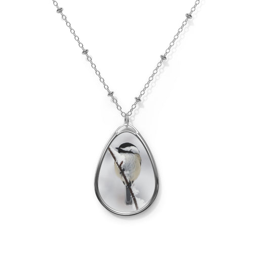 Teardrop-shaped pendant with a black-capped chickadee photo