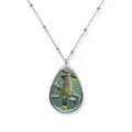 Teardrop-shaped pendant with a cedar waxwing photo