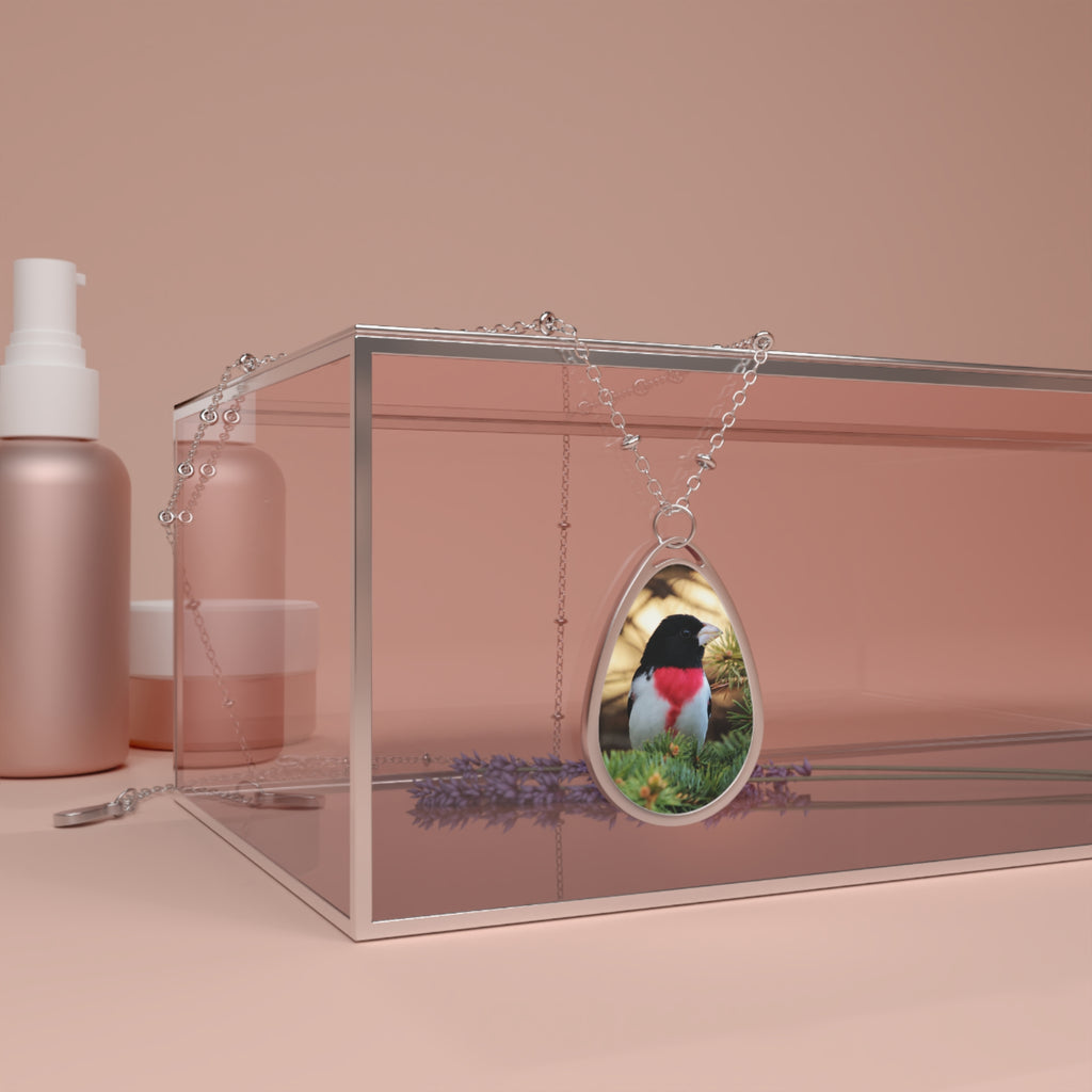 Teardrop-shaped pendant with a rose-breasted grosbeak photo