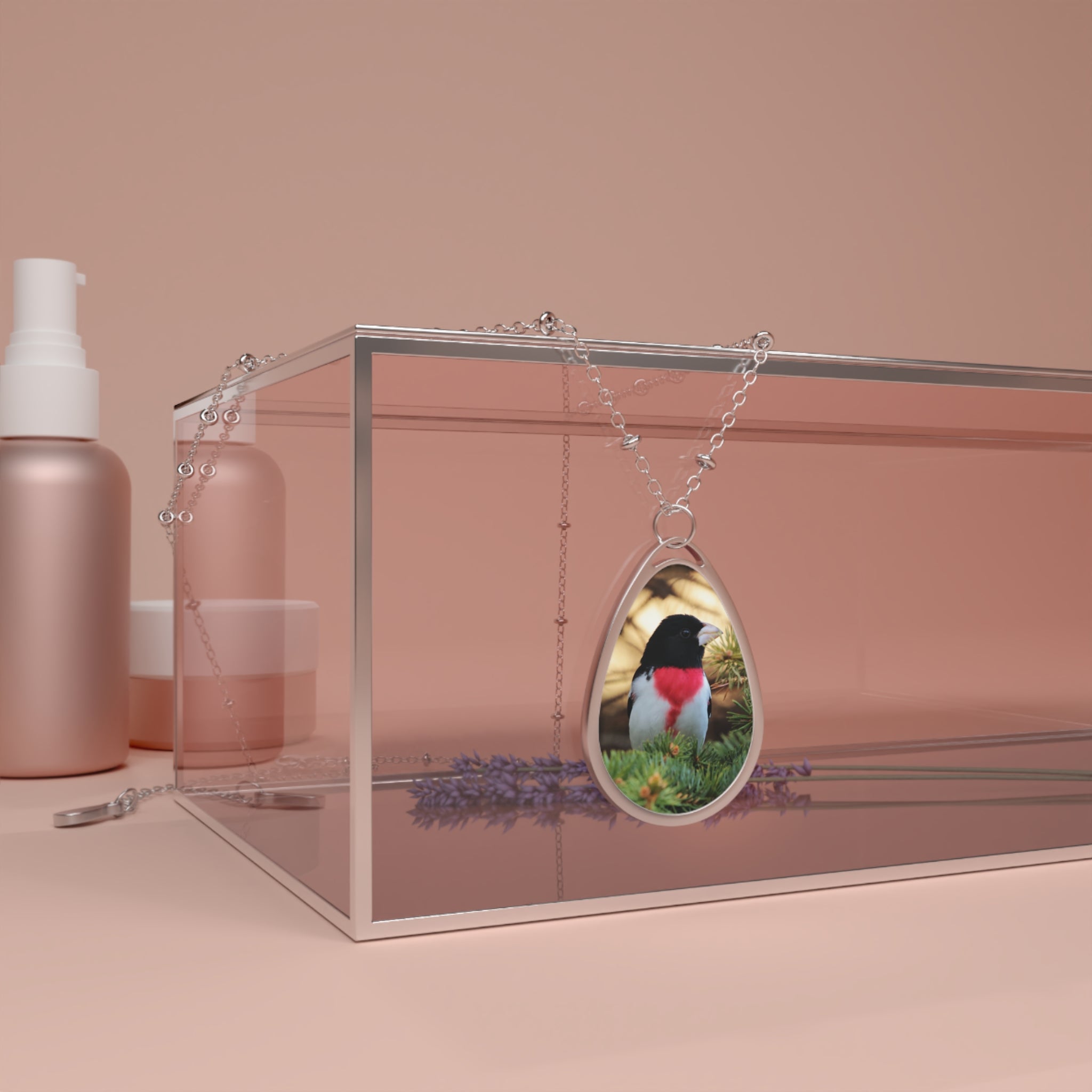 Teardrop-shaped pendant with a rose-breasted grosbeak photo