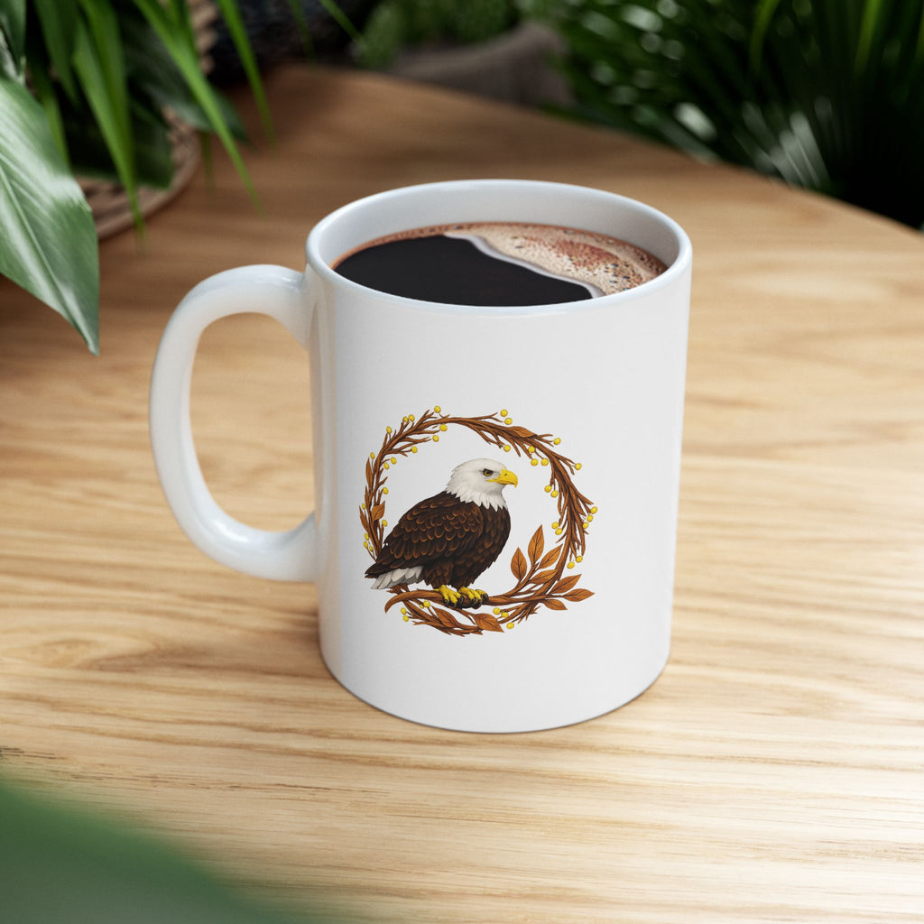 White mug with an eagle design on a wooden table