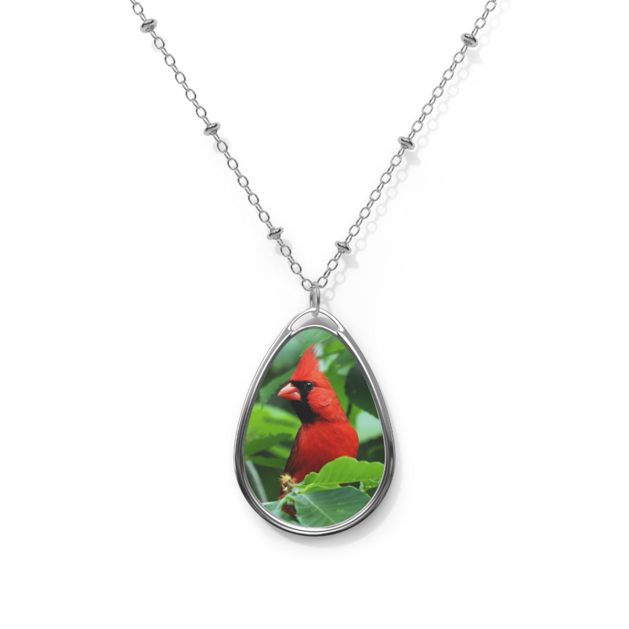 Teardrop-shaped pendant with a northern cardinal photo