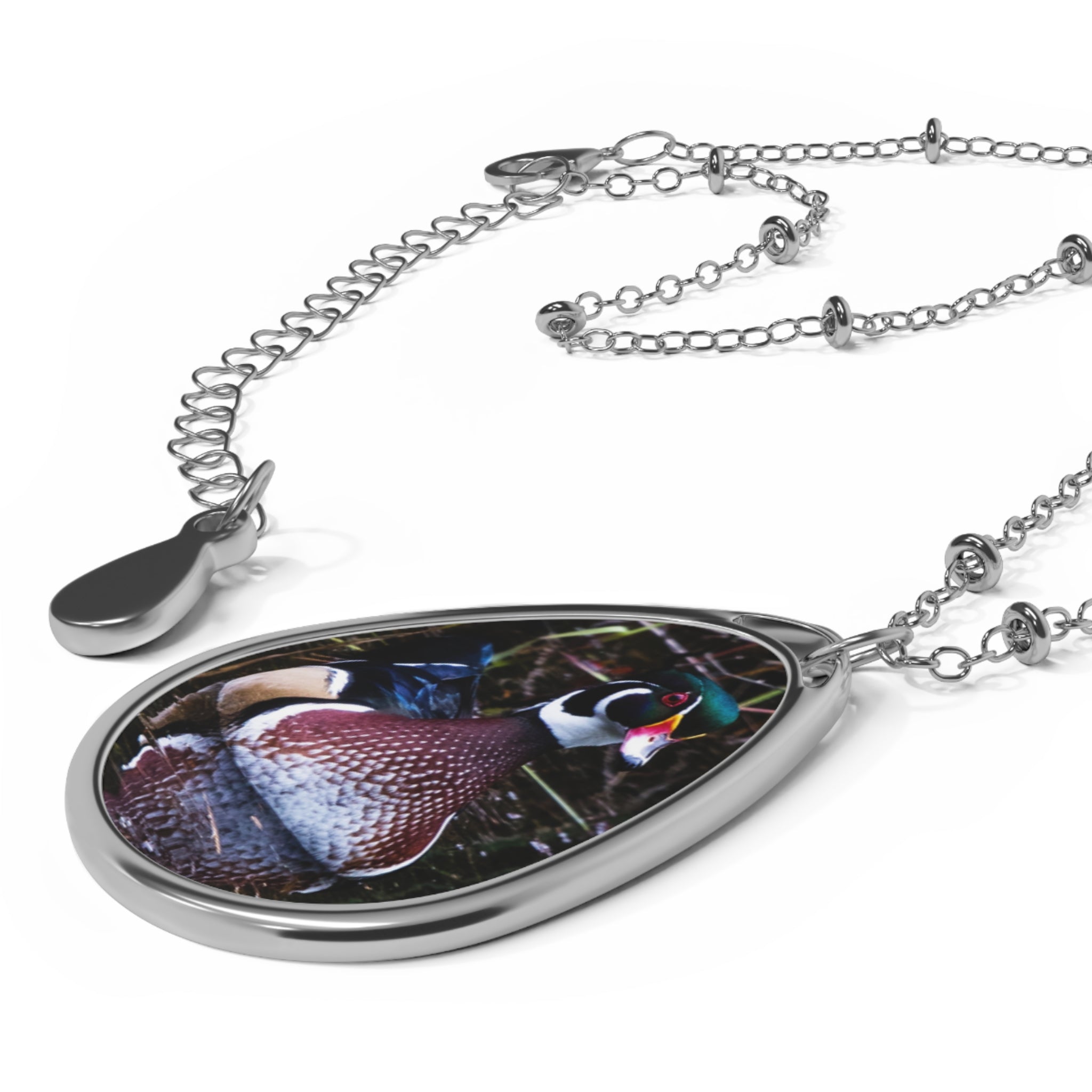 Teardrop-shaped pendant with a wood duck photo