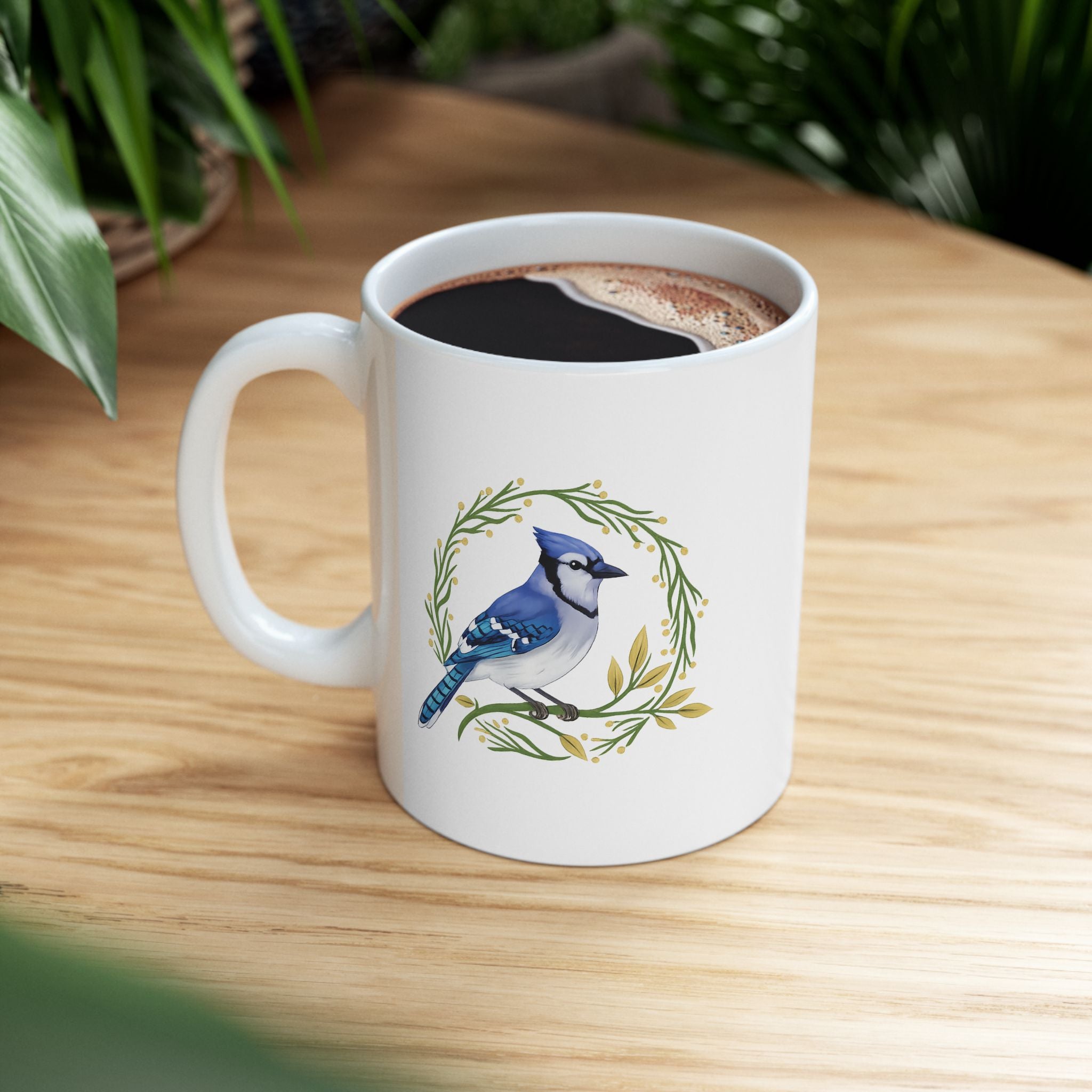 White mug with a blue jay design