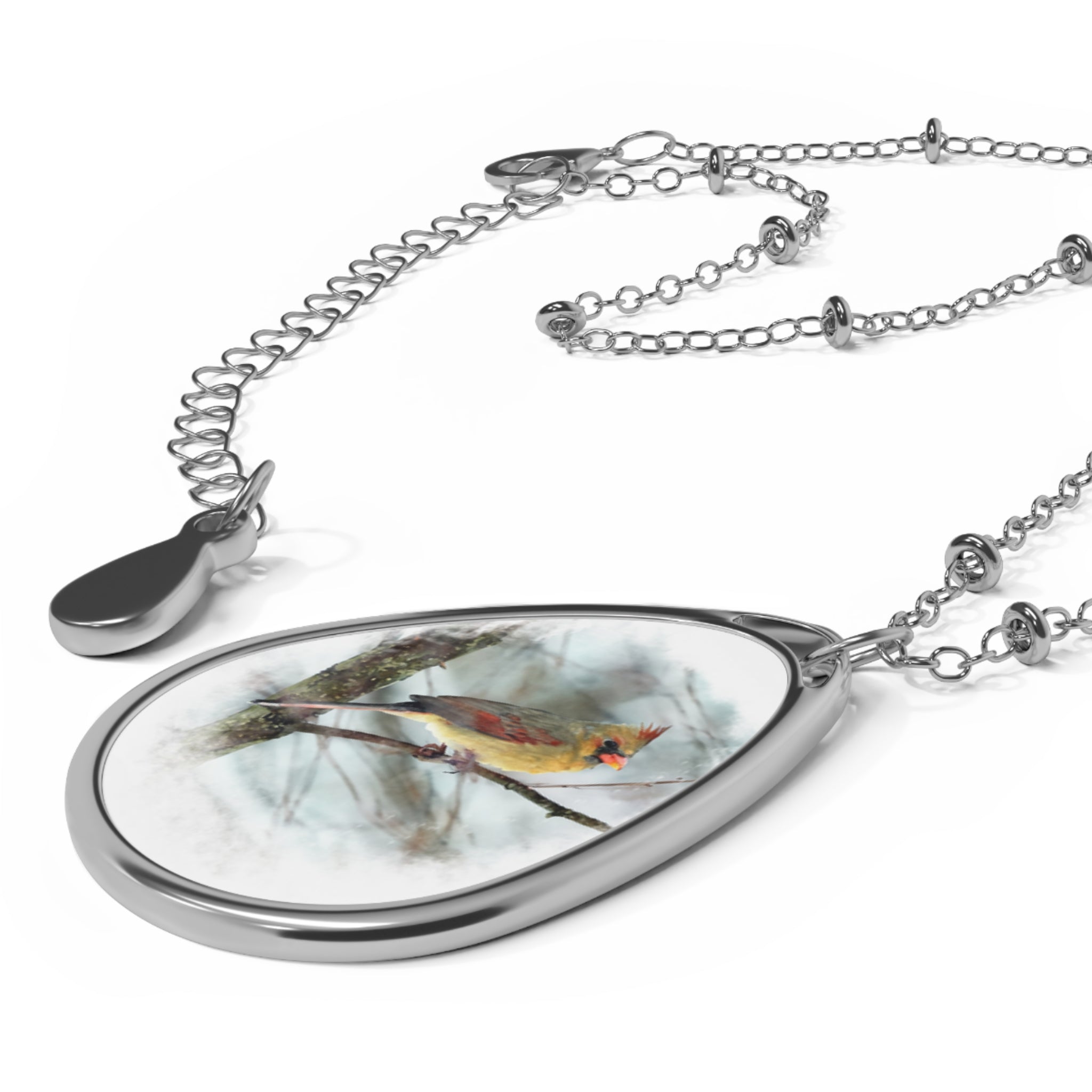 Teardrop-shaped pendant with a female northern cardinal photo